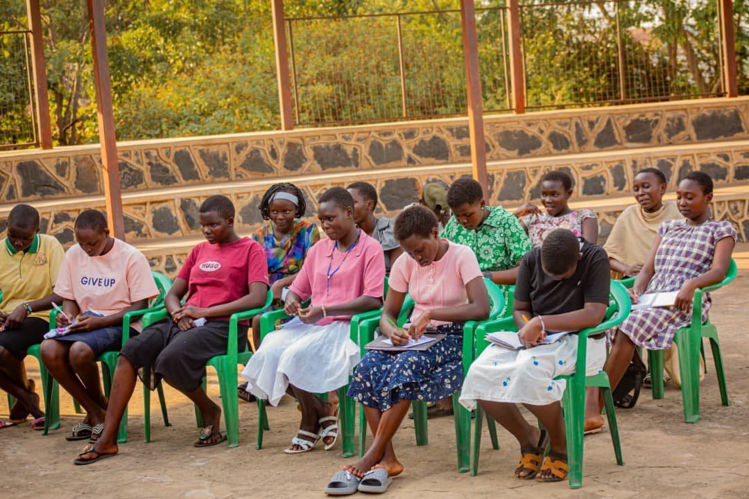 Girls Rising Life Readiness participants writing notes